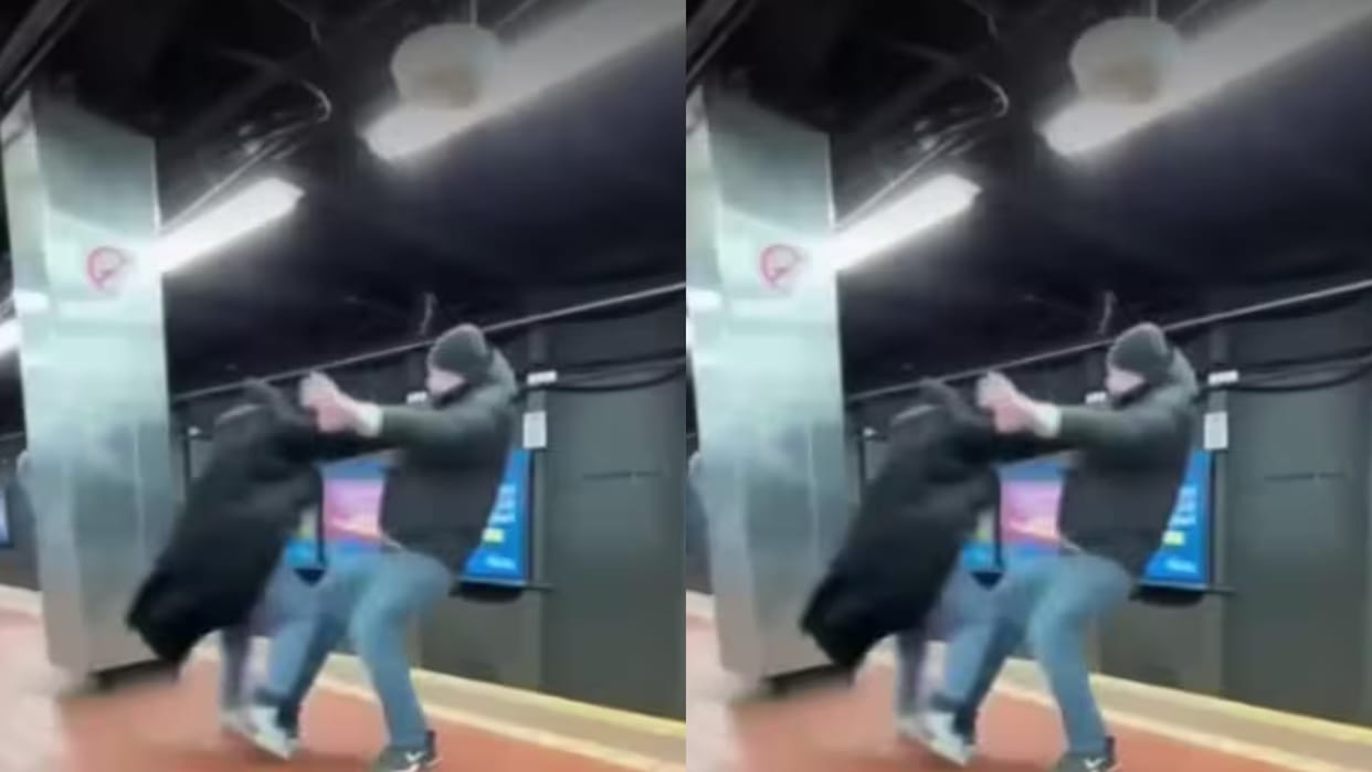 A fierce fight broke during which the man fell onto the tracks and a train passed overhead Video Viral