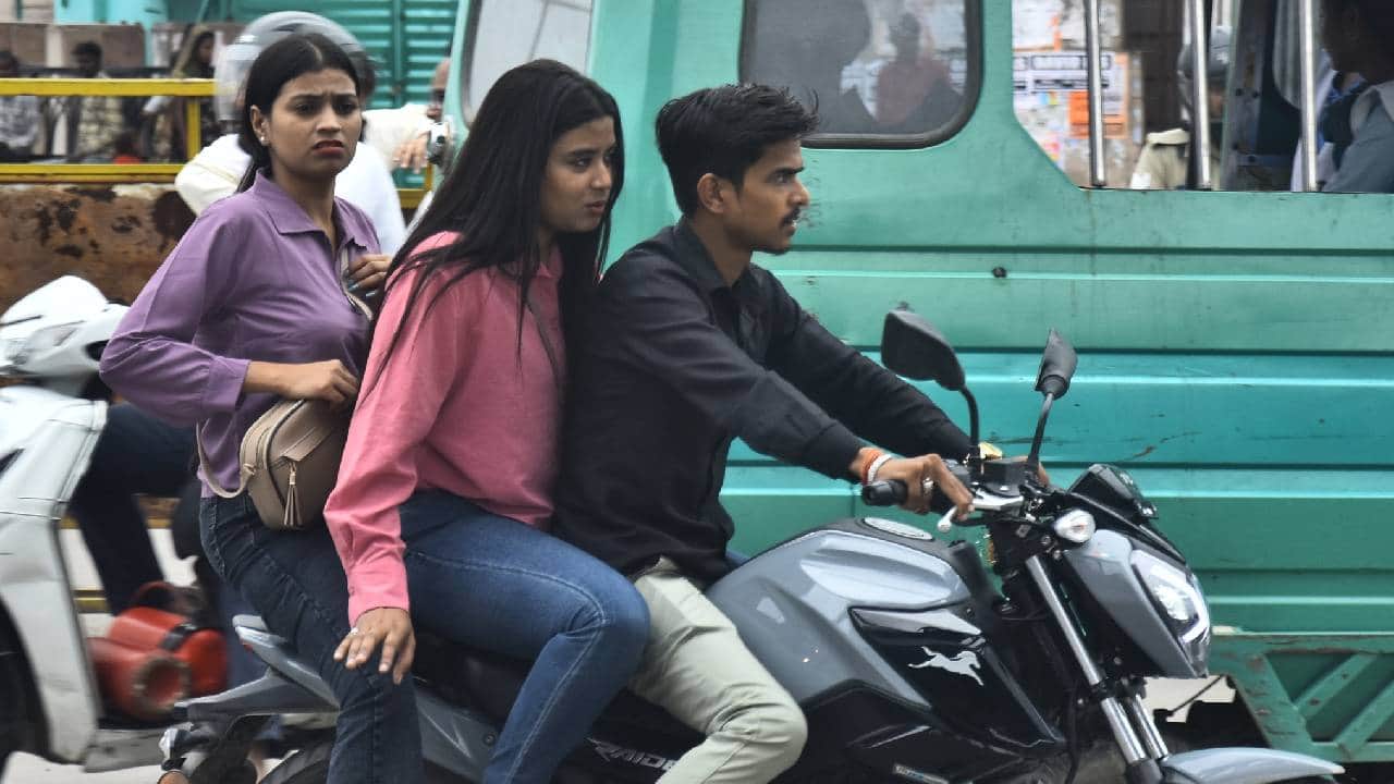 Lucknow: Those in uniform are breaking the rules, riding without helmets and triple-riding; see photos