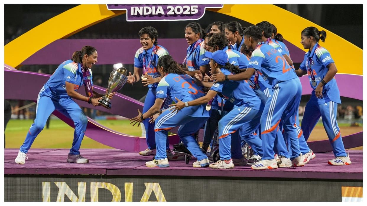Captain Harmanpreet Kaur touching ICC Chairman Jay Shah's feet at the stage after Womens World cup title win