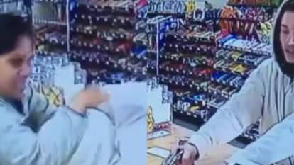 A thief was trying to rob a shop by showing a gun but a woman caught him and beat him so badly Video Viral