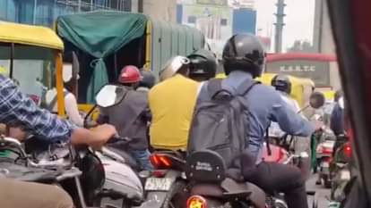 Man wears a kadhai instead of a helmet to avoid a traffic challan leaving people in splits Video Viral