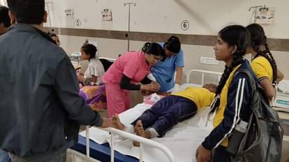 Auto filled with a dozen school children went out of control and overturned two children seriously injured in