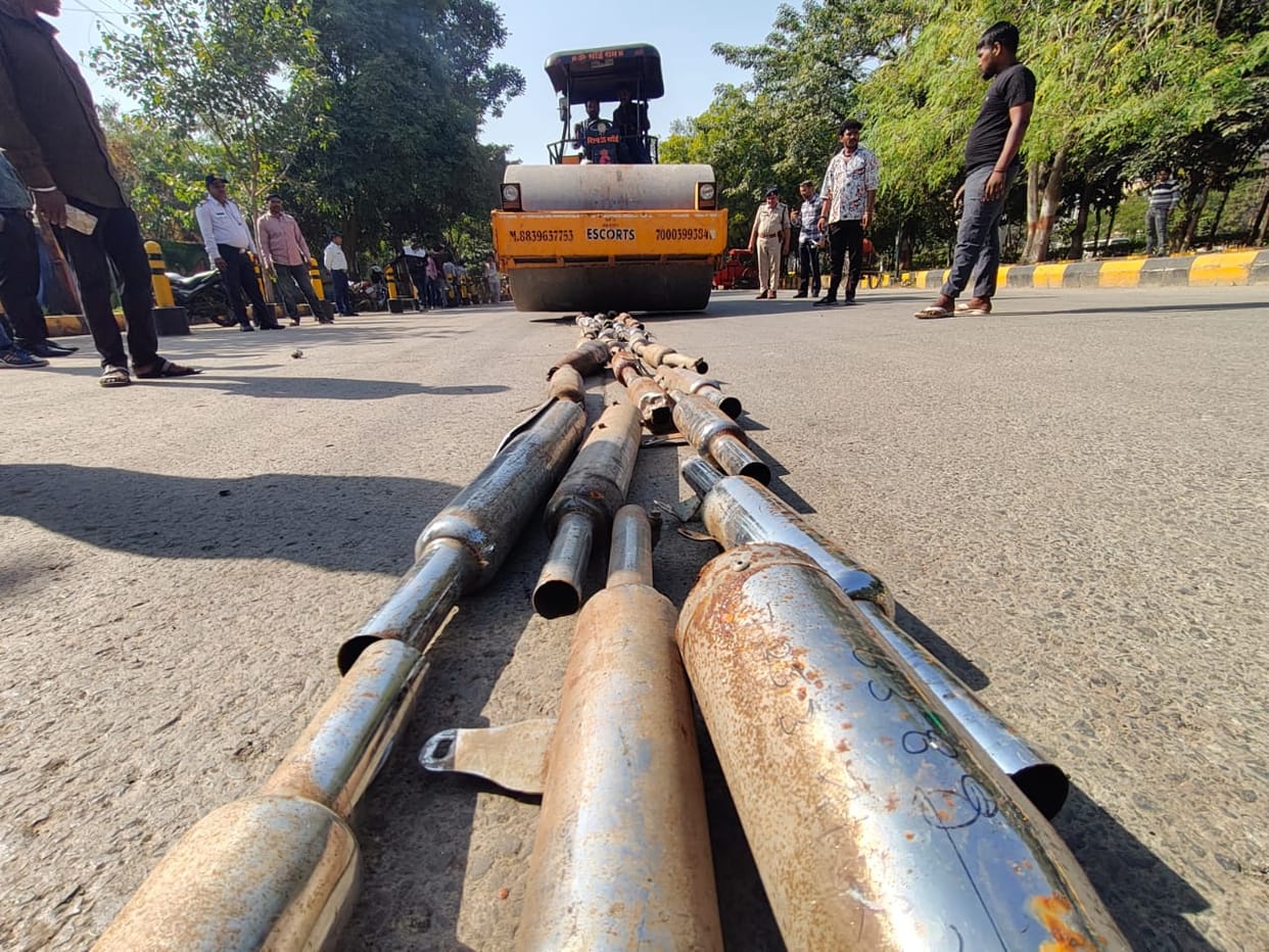Indore: Traffic police run bulldozers on silencers and horns seized from vehicles