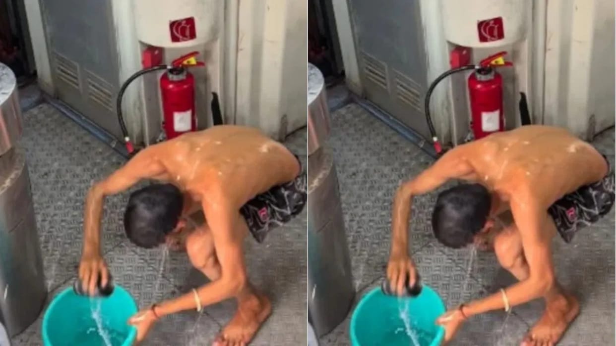 Passenger takes a bath with a bucket in the train without any worry people are furious video goes viral