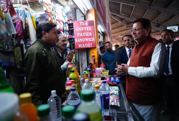 CM Dhami Surprise inspection at ISBT Dehradun angry to see garbage cleaned it himself with a broom
