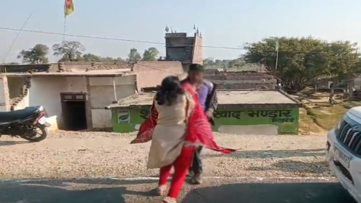 man stood in front of a car on the road woman pushed him and said Go away in Shahjahanpur