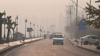 Shikaras were seen moving amidst the morning fog at the famous Dal Lake.