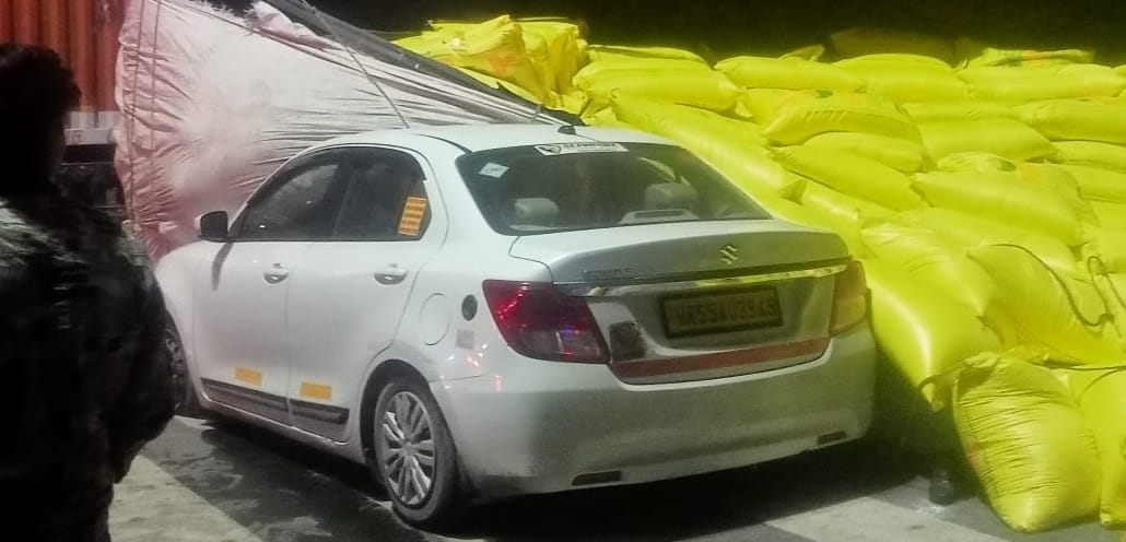 truck carrying urea overturned on car after colliding with a container