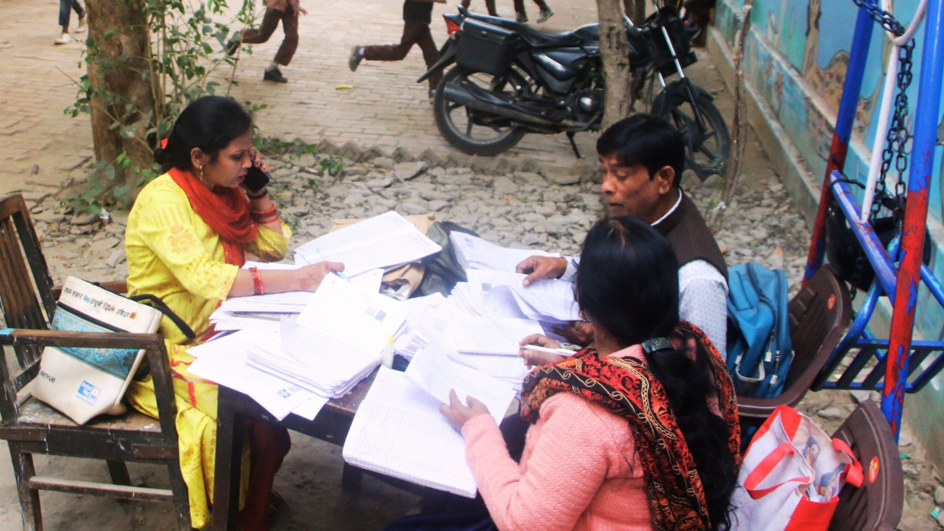 Children searching for teachers and teachers searching for voters monitors taking classes in varanasi