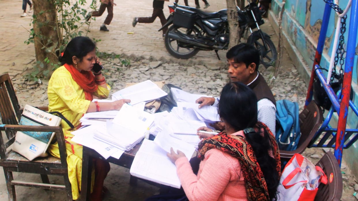 Children searching for teachers and teachers searching for voters monitors taking classes in varanasi