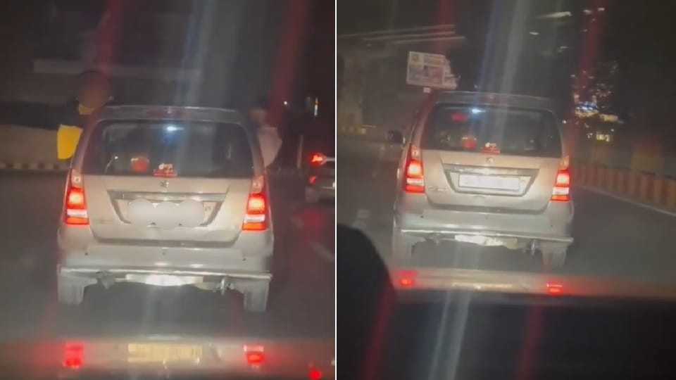 Minor garage workers perform stunts on a car that came in for service