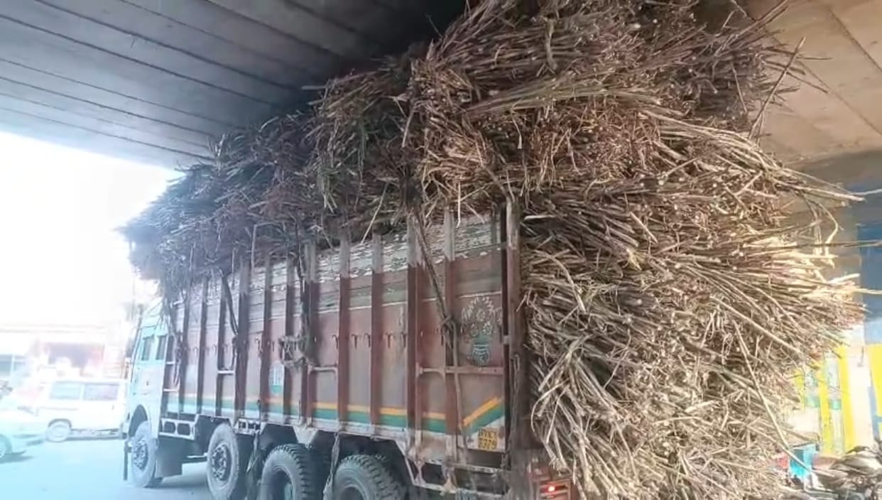 Overloaded Sugarcane Truck Stuck Under Flyover in Meerut-Karnal Highway, Massive Traffic Jam