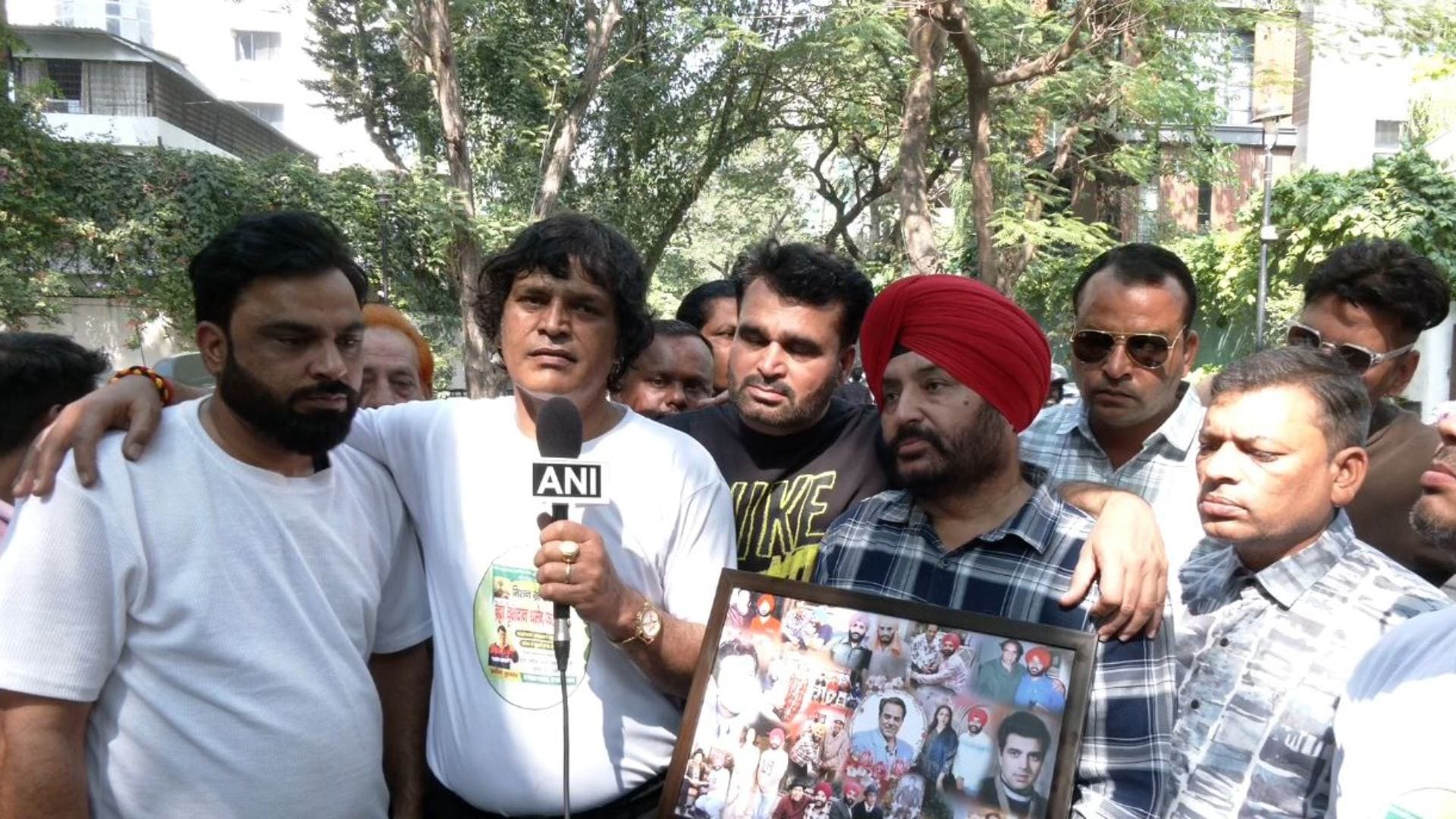 Fans gathered outside Dharmendras residence to celebrate late actors 90th birth anniversary