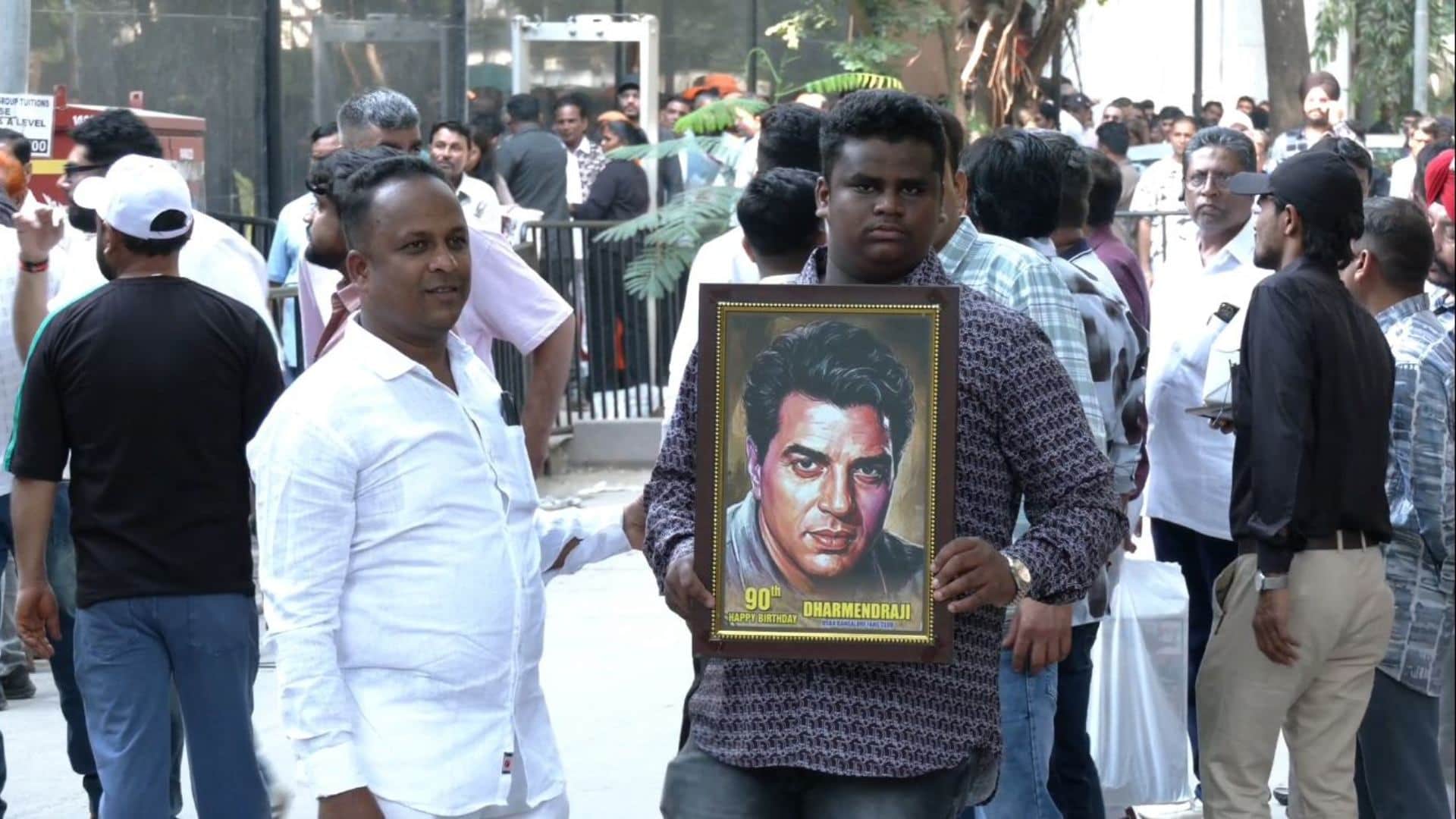 Fans gathered outside Dharmendras residence to celebrate late actors 90th birth anniversary