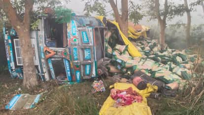 truck overturned in a ditch while trying to avoid a car on the highway in pilibhit