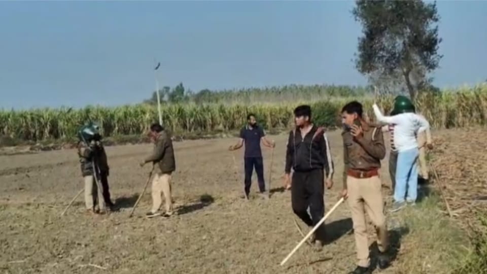 Villagers wearing helmets are searching for leopard in the forest of Roni Harjipur.