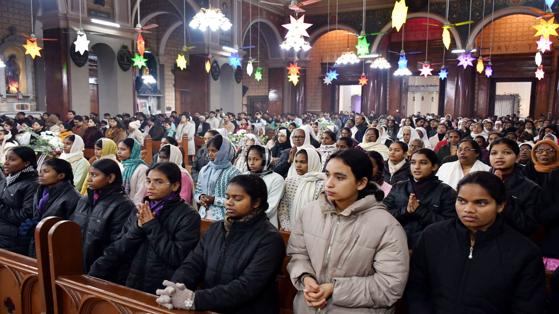 Happy Christmas: Church bells ring during midnight service, churches illuminated with candlelight