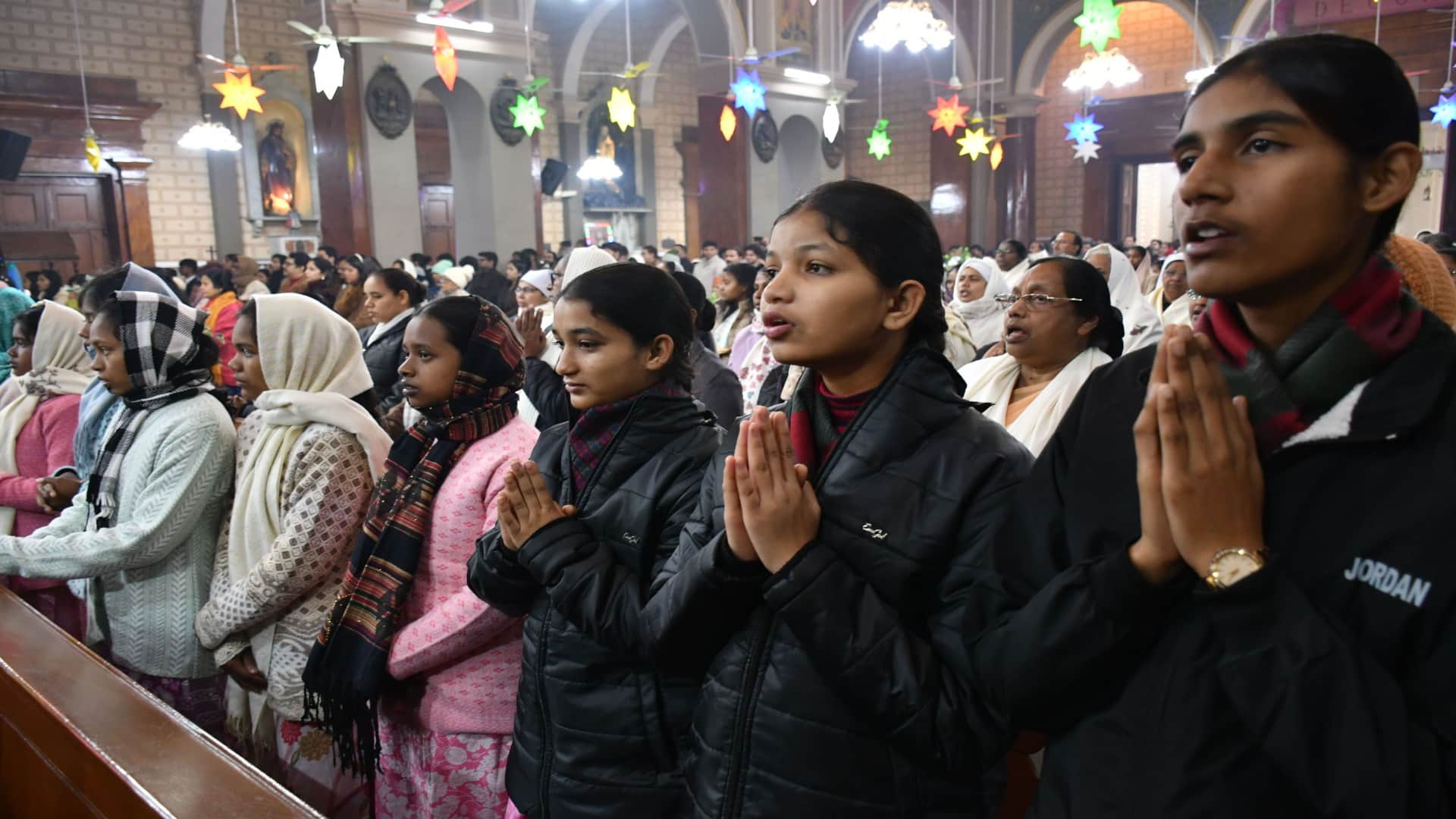 Happy Christmas: Church bells ring during midnight service, churches illuminated with candlelight
