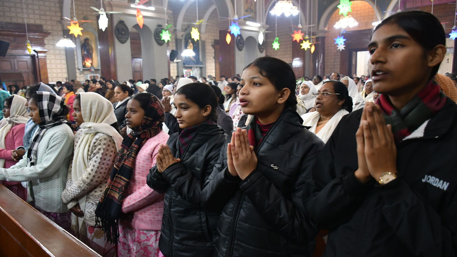 Happy Christmas: Church bells ring during midnight service, churches illuminated with candlelight