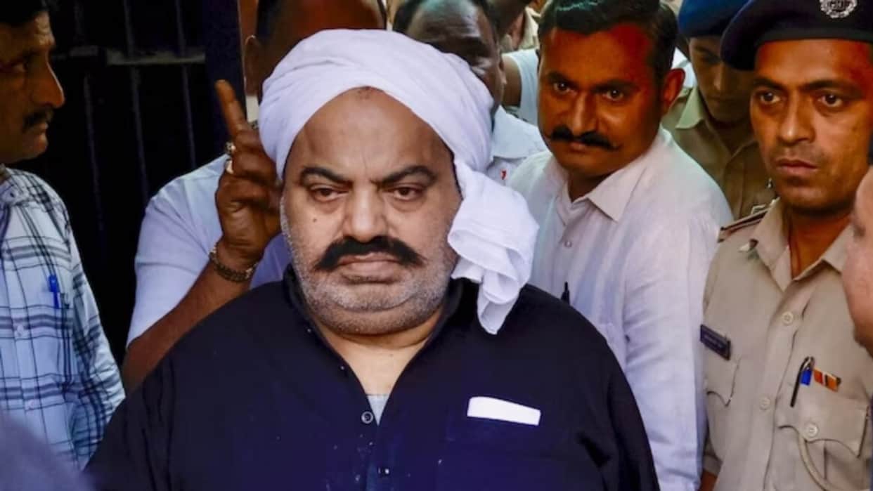 Two vehicles from Atiq's son Umar's convoy seized; case involves breaking a toll plaza barrier.