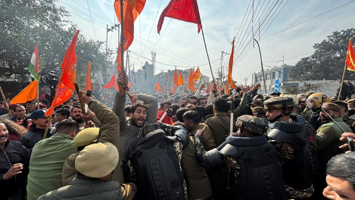 Shri Mata Vaishno Devi Sangarsh Samiti members hold a protest outside Lok Bhawan in Jammu