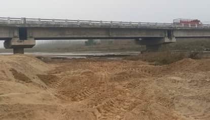 The dry river has changed its course, and the bridge's foundation is cracking