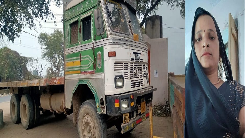 A woman crossing the road crushed by a truck