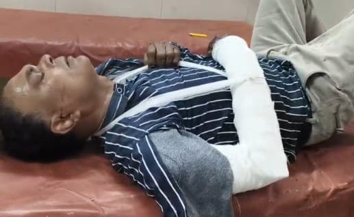 criminals' car ran over motorcyclist, and when they encountered barricade, they sped away in reverse gear