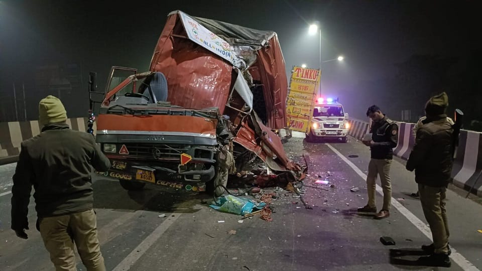 A canter truck collided with the back of another truck on the highway the driver was injured in Hapur