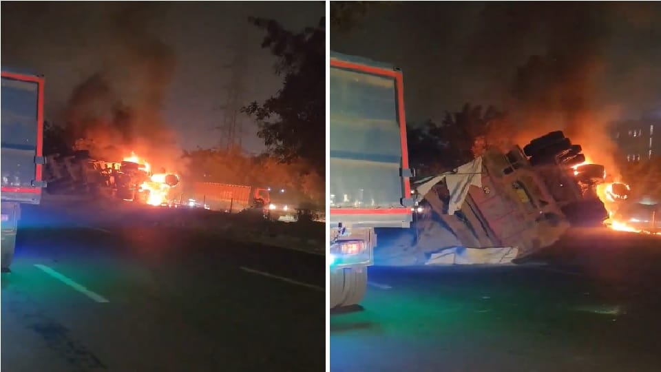 Truck hits divider loses control and overturns cabin catches fire