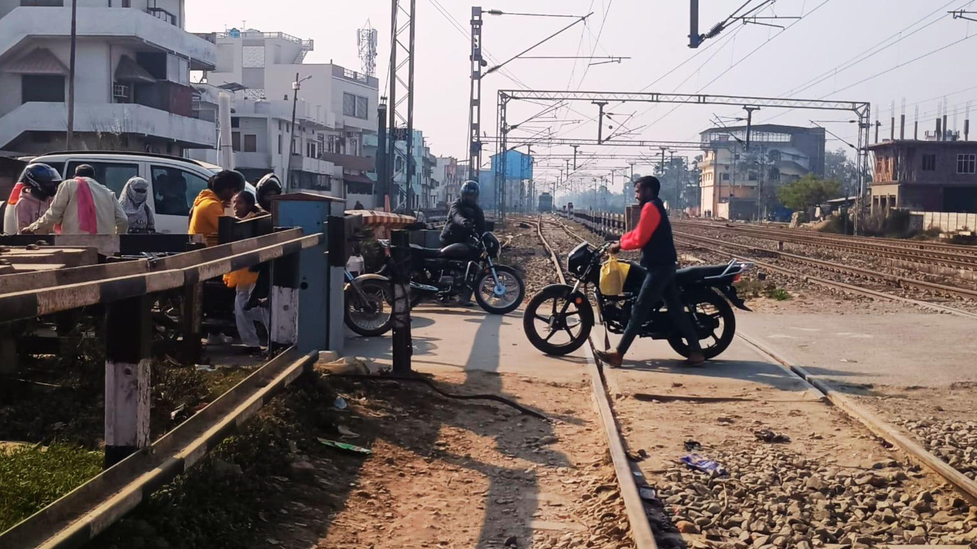 People crossing railway tracks going under boom barriers rules being ignored at station in ghazipur