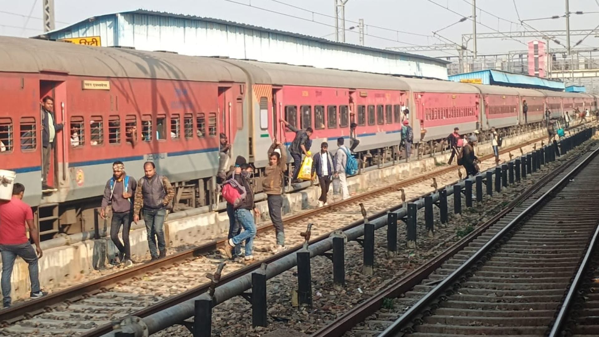 People crossing railway tracks going under boom barriers rules being ignored at station in ghazipur