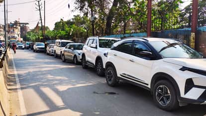 Houses line narrow streets vehicles parked on road causing traffic jams in varanasi Traffic