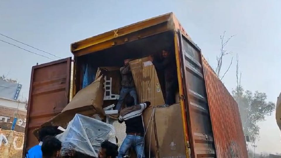 containers filled with 118 refrigerators caught fire after contact with high-tension power line
