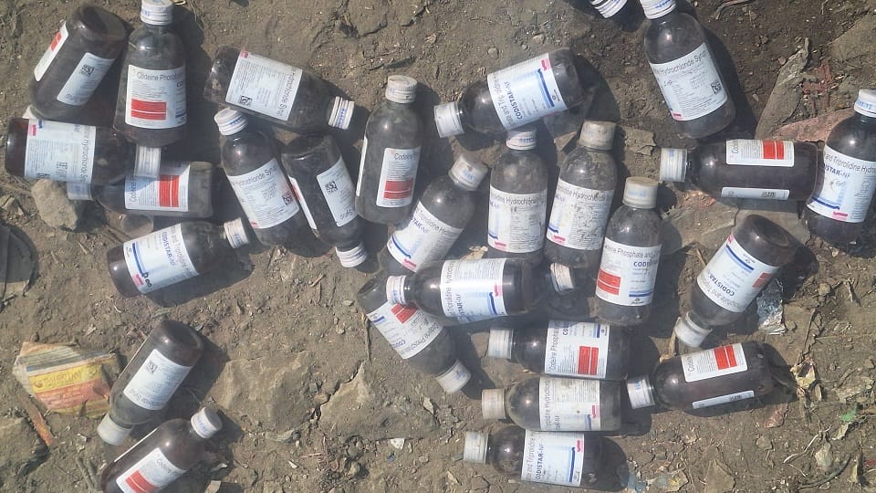 Bottles of banned codeine syrup found lying on a garbage heap