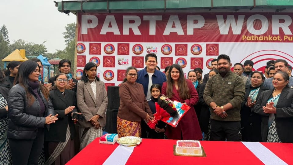 Pratap World School completes 20 glorious years students teachers and management cut cake to celebrate