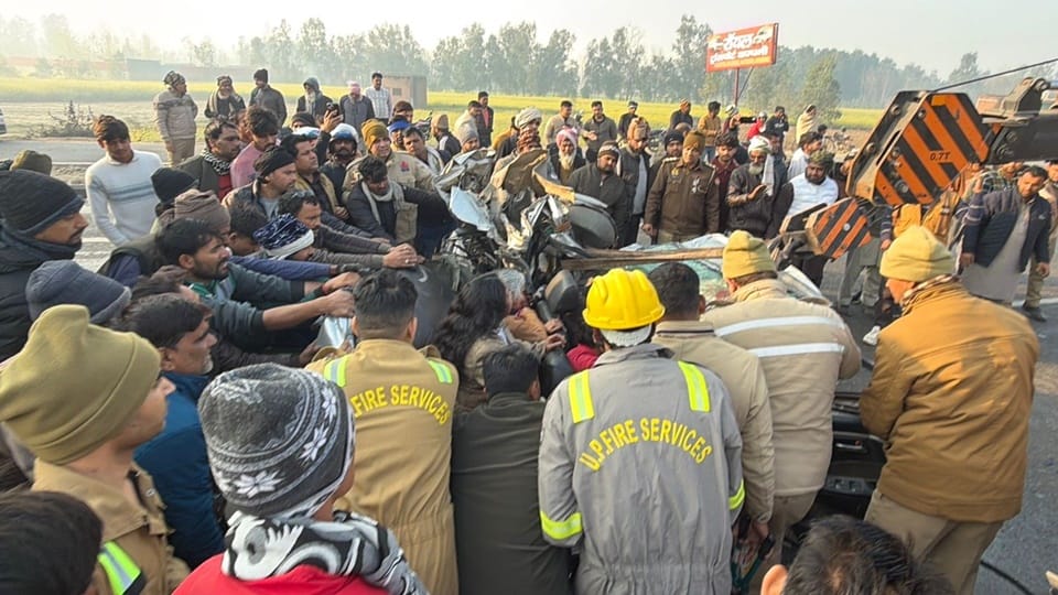 Rampur: Car trapped between two dump trucks; two dead, including a child
