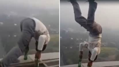 A young man was seen performing stunts on a tower