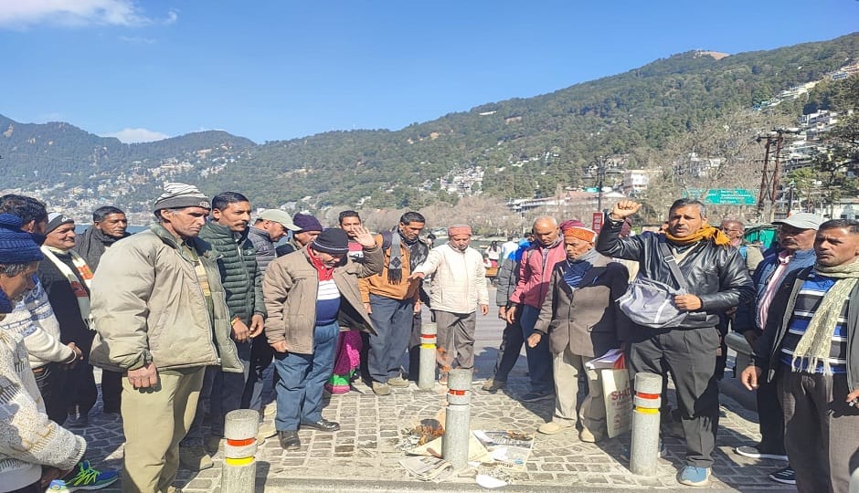 Regular work-charge employees protested against the government, burning copies of the pension order