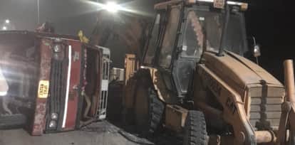 Auraiya Accident DCM truck loaded with wood overturned on the highway The driver was injured