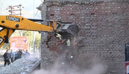 JCBs demolished houses before the road widening project in kathgodam