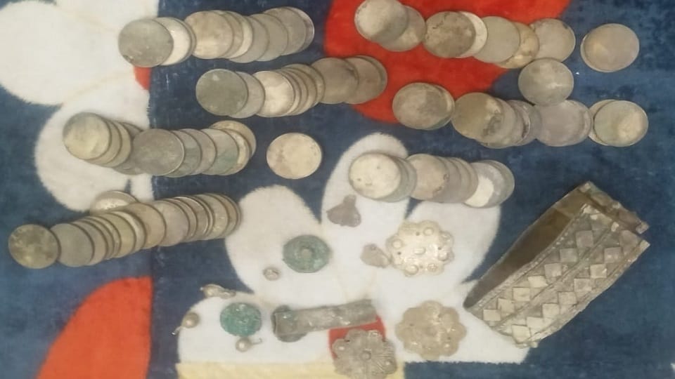 Silver coins and jewelry found during excavations in Sonipat
