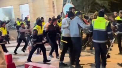 A clash occurred between a security guard and a delivery boy at the society gate