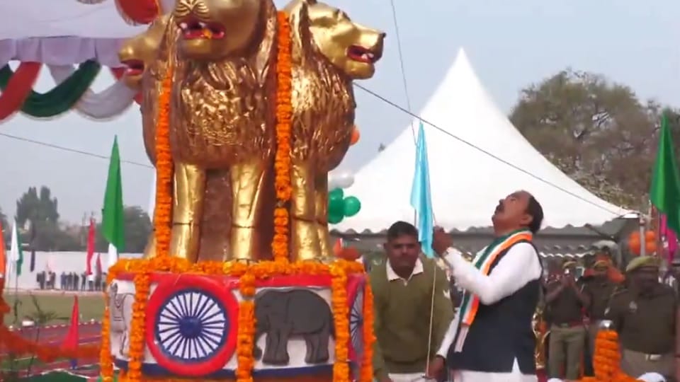 Keshav Prasad Maurya unfurls the National Flag during the 77th Republic Day celebrations in Prayagraj