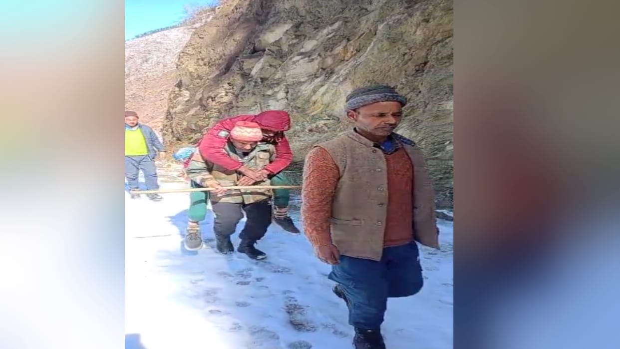 sick elderly man carried on back, walking six kilometers through one and a half to two feet of snow.
