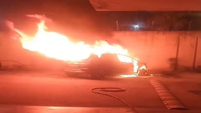 massive fire broke out in  car parked in apartment parking lot