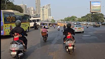 Father While taking care of his daughter sleeping on the scooty video goes viral on social media