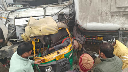 Auto got stuck between two trailers.everyone was shocked to see the horror of the accident.