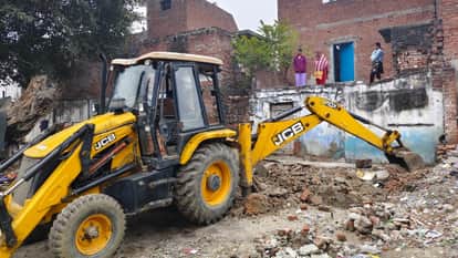 bulldozers action against encroachments demolishing illegal constructions on railway land in Bareilly