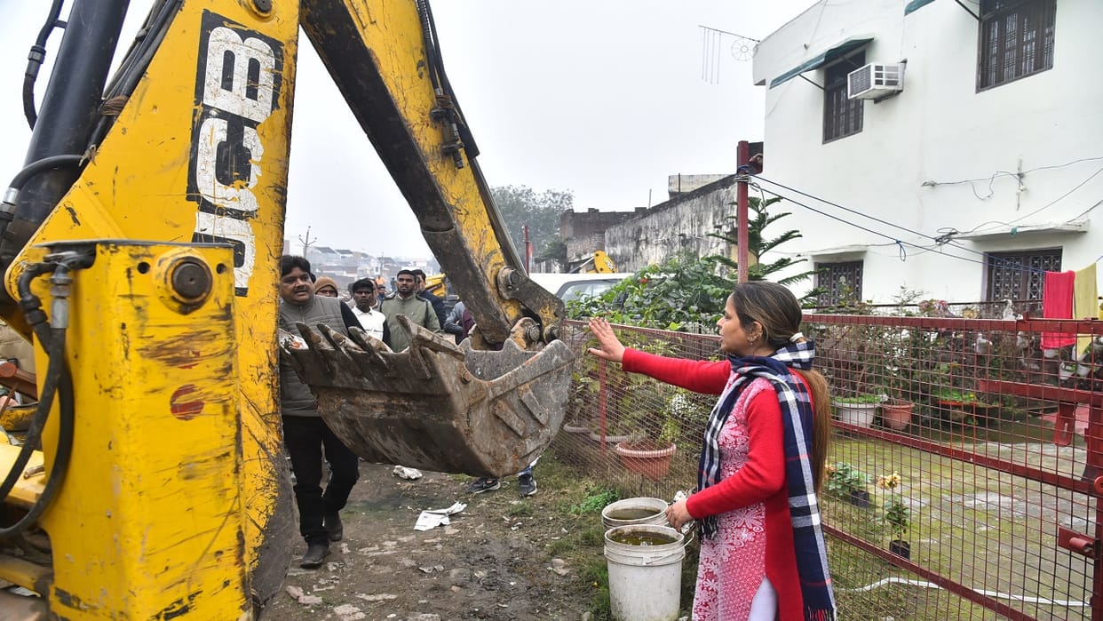 bulldozers action against encroachments demolishing illegal constructions on railway land in Bareilly